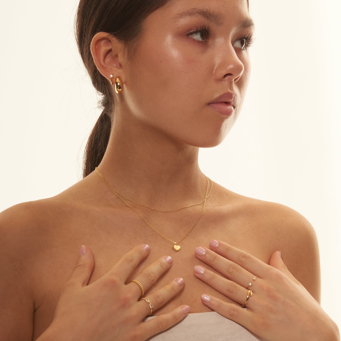 Solitaire CZ Embellished Gold Huggie Hoops Simple Round Gem Hoop Earrings by Doviana