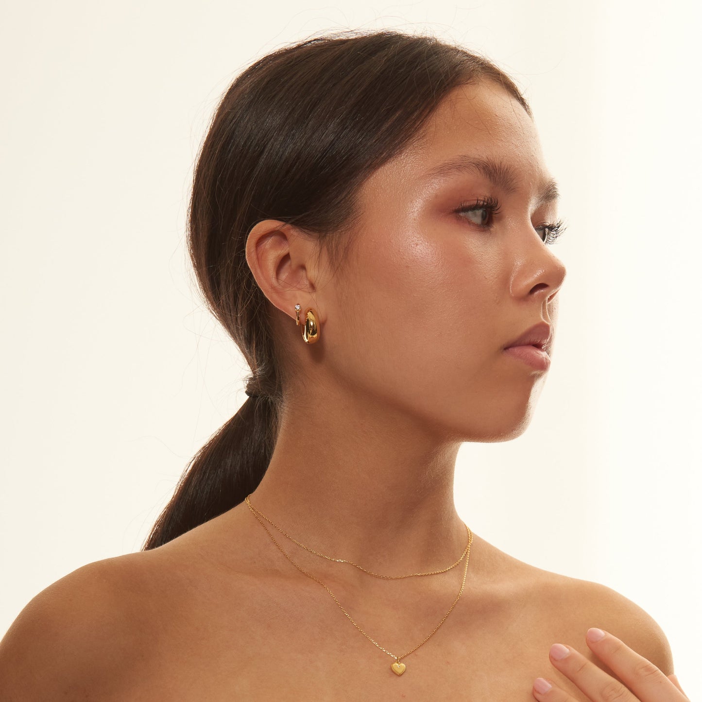 Solitaire CZ Embellished Gold Huggie Hoops Simple Round Gem Hoop Earrings by Doviana