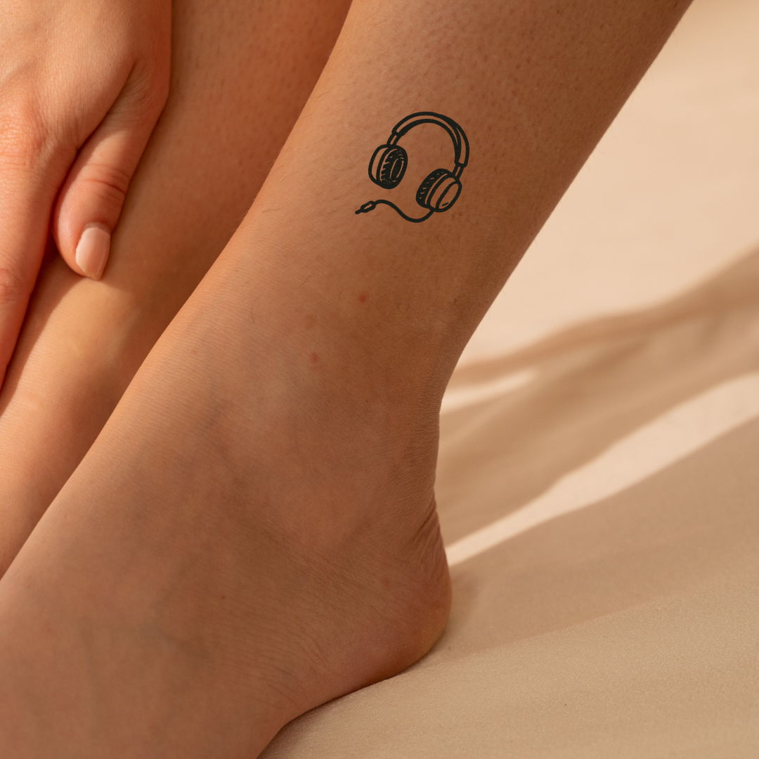 Headphones - A Symbol of Rhythm & Self-Expression  by DOVIANA Tattoo Studio (width 0.4‘’)